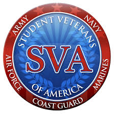 The Student Veterans of America logo consisting of a blue circle with a vertical laurel leaf crown opening at the top and a rising sun denoted by alternating blue striped radiating lines with the horizon in the middle of the circle displayed in shades of blue within it, a red ring frames the blue circle with seven red stars on the upper arch and alternating red-colored stripes on the bottom arch. ‘Student Veterans’ follows the arch on the top half of the blue inner circle with ‘of America’ following the bottom arch all in white capitalized letters. ‘SVA’ is centered on the blue circle in red, capitalized letters and a white outline. In the red circle, ‘Army’ and “Navy” appear in white font covering the last two stars on the left and right of the top arch. ‘Air Force’, ‘Coast Guard’, and ‘Marines’ are equally spaced along the bottom curve of the red ring also in white font.