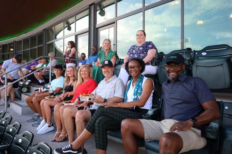 Foundation members and donors at a Green Jackets game