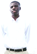 A young black male in a white collared shirt wearing brown khakis and a black belt. He is standing with his hands behind his back posing for a photo.