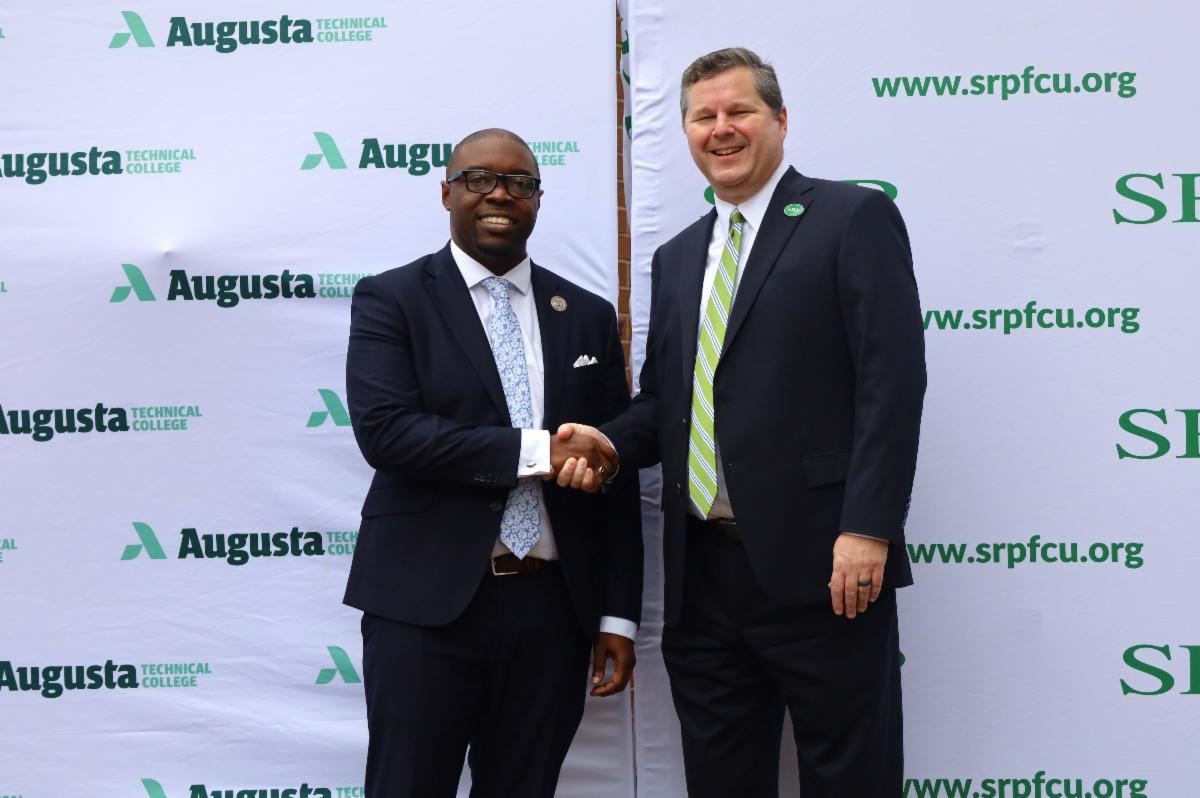 Dr. Jermaine Whirl, President of Augusta Technical College shaking hands with Mr. Eric Jenkins, CEO of SRP.