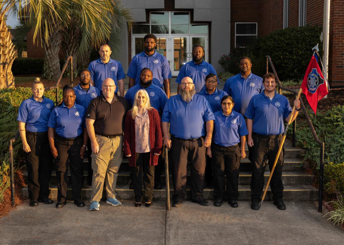 Law Enforcement Academy Class 033 standing with Eric Snowberger and Amanda Bryant.