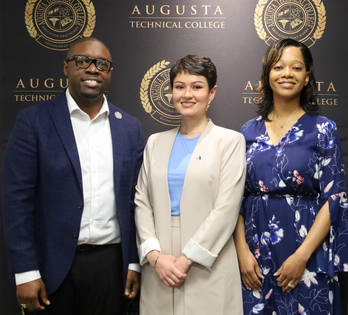 Dr. Jermaine Whirl and Ms. Marqueta Whirl stand with Ms. Rashell Tanner