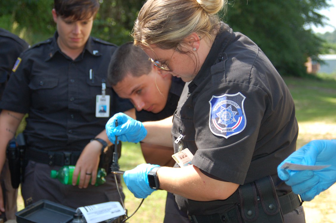 An image of Augusta Technical College Law Enforcement students participating practicing fingerprinting.